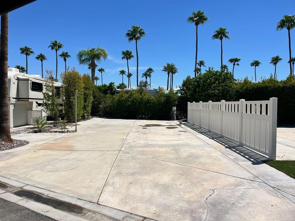 Lot 42, Convenient to the neighborhood tennis court, pool, jacuzzi, laundry and perfectly maintained bathrooms, this south to north oriented space with nice concrete offers wonderful morning sun and afternoon shade. Surrounded by lush green hedging it’s convenient to the resort entrance, large LaPalma clubhouse and restaurant. Outdoor Resort Palm Springs (ORPS) is a Guard Gated 5-Star RV Resort Community offering an active and luxurious lifestyle featuring golf (27 holes), tennis, pickleball, swimming and more! Two clubhouses, fitness center, beauty solan, La Roma Restaurant on campus, dog park and more!