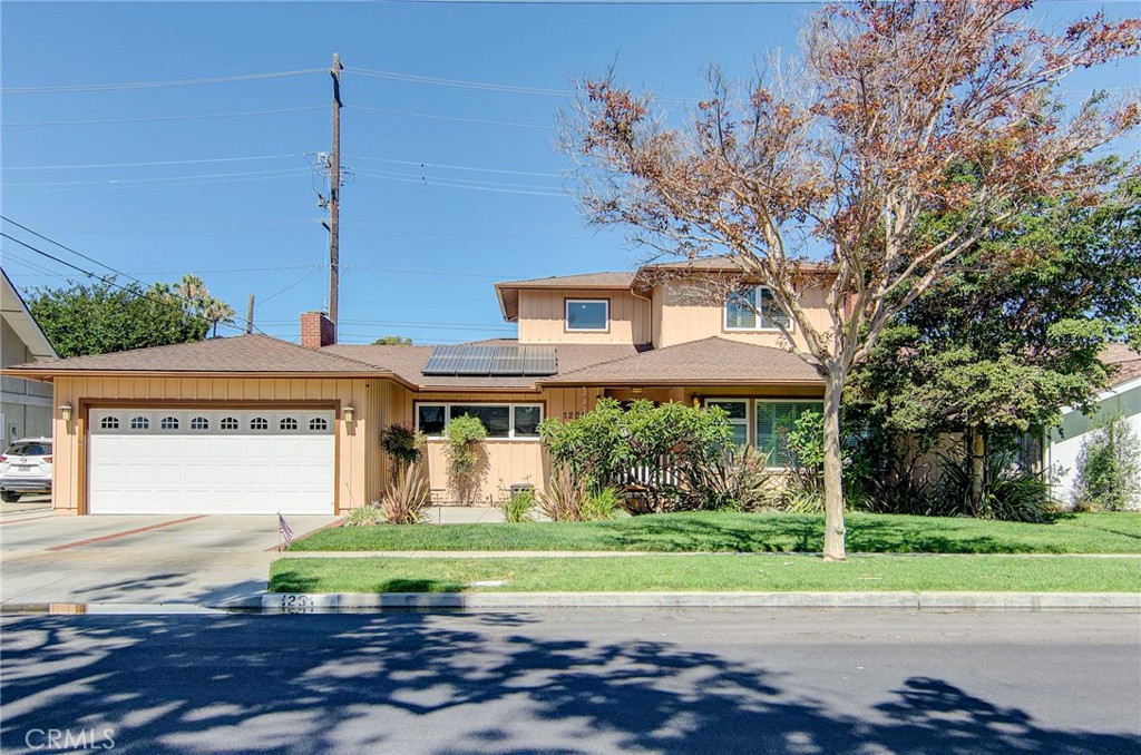 Fantastic purchase opportunity on this gorgeous 5 br 4.5 ba pool home with paid off 24-panel solar system located in the coveted "La Marina Estates" neighborhood adjacent to CSULB. Desirable floor plan with 3 br 2 ba downstairs, 2 br 2 ba (ensuite) upstairs, and 1/2 bath in garage accessible from the pool area. Fresh interior and exterior painting as well as pergola painted and balcony deck recoated in 2025. Beautiful curb appeal with brick lined hardscape and driveway, mature foliage, covered porch with slate floor tiles, gleaming wood floors throughout the living areas, formal living room with fireplace, plantation shutters, crown molding & recessed lights, separate family room with fireplace & sliding doors leading to backyard, bright kitchen with ample cabinets, LG HI-MAC countertops, built-in corner dining bench, custom soffit "Tray" ceilings in living room & family room for enhanced ceiling heights, 3 downstairs bedrooms (ceiling fans, mirrored wardrobe doors, sliding glass doors leading to backyard), 2 baths with tiled tub, shower and dual sink vanity (full bath), 2 ensuite bedrooms upstairs, primary bedroom with soffit "Tray" ceiling, ceiling fan, sliding doors leading to wrap around balcony, primary bath with custom travertine tiled separate tub & shower, dual sink vanity, walk-in closet, second ensuite bedroom with travertine shower and floors, forced air heating and central air conditioning, oversized 2 car direct access garage with laundry area, built in storage cabinets and attic storage, sparkling pool, above ground spa & huge pergola area in backyard with custom retractable shades perfect for entertaining, and outdoor shower for pool & beach clean off. Upgrades include lifetime guarantee Milgard dual pane windows and sliders (2007), sewer pipe & cleanout replacement (2024), pool replastered (2023), insulation in all floors, walls and ceilings, HVAC installed, electric panel upgraded, central vacuum system upgraded (2007), Nest Smart Thermostat, wall switched/speed controlled ceiling fans, dimmable ceiling lights & illuminated dimmer switches, family room surround sound system with separate exterior speakers over patio & pool, landscape lighting in front & back yards & natural gas fed backyard grill. Every appointment was carefully considered & upgraded and home lovingly cared for and enjoyed. Don't miss out!