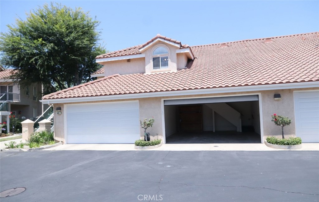 Located in the desirable Gated Wood Ranch community, This 2 bedroom 2 bath has a bright and spacious layout, large balcony/private patio overlooking amazing views of the mountains and community. Step into this spacious second floor unit with high ceilings a wet bar and fire place. The spacious kitchen offers lots cabinets, wrap around counter top and breakfast nook area with new appliance. Unit also offer in unit washer dryer 2 car garage with direct access to the unit. Gated community offers a pool, and a lake.
