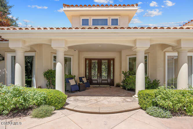 Beautifully appointed custom 6498 Square foot estate on 1.25 acres of park like grounds! This 5BD+8BA include two pirmary suites. The ground floor suite includes a dual sided marble fireplace, spa tub, large glass shower, walk in closet, private patio that leads to the rear grounds. The second private suite includes a wet bar, private terrace with views of the grounds and full marble spa bathroom retreat along with a huge walk-in closet. This custom home features a gourmet chef kitchen w/ large island, custom cabinetry, gorgeous granite, SubZero, Wolf and Cove stainless steel appliances plus butlers pantry w/ warming drawer and wine fridge. Kitchen spills into oversized family room w/ custom cabinets and cozy fireplace. This home features a formal entry w/ stunning views of lush backyard, formal living room, formal dining room, oversized bedrooms.The yard features two built-in BBQ areas, two outdoor televisions, fire pit, putting green, working greenhouse, 4 fountain, 3, indoor fireplaces, sparkling pool with many rock waterfalls, and a huge water slide, spectacular walkways throughout, gorgeous rose garden, and an orchard with orange, lemon, apple, avocado, plum, peach, apricot and lime trees. The stunning guest house includes newer tile flooring, custom window coverings, a kitchenette and so much more.This is the haven you are looking for.