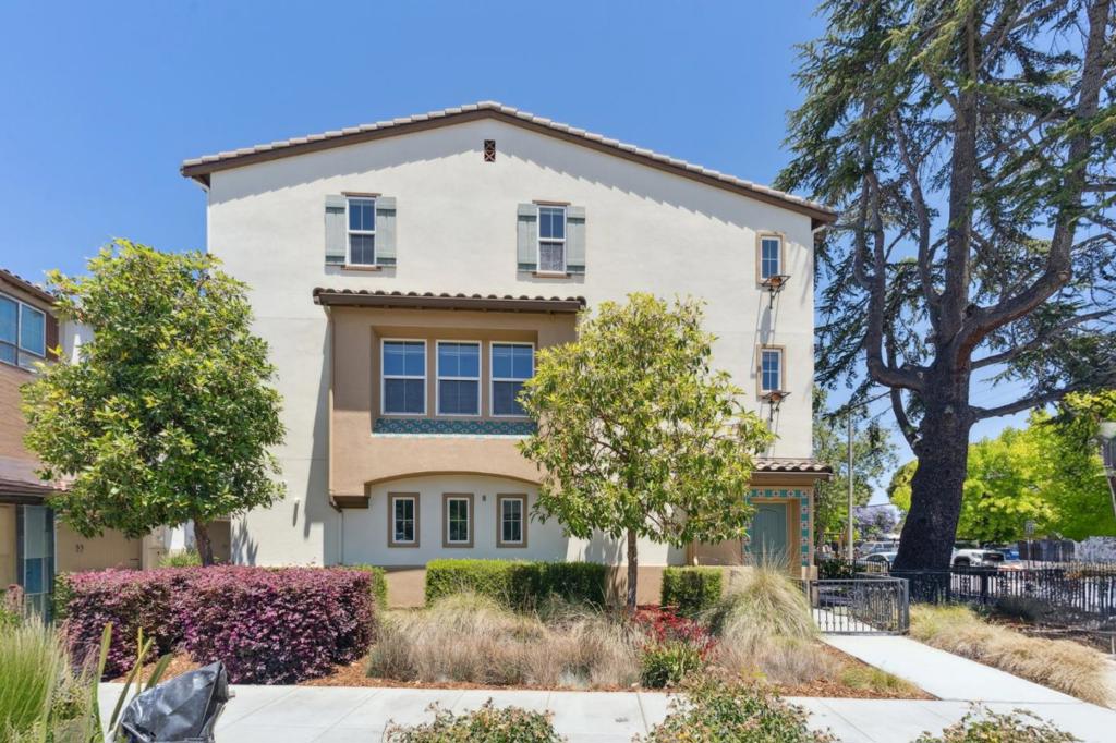 With its corner placement, abundant upgrades, and a layout designed for both flexibility and comfort, this former model home in Sunnyvales Murphy Park community makes an impressive first impression. The main level unfolds into a bright, open space where natural light highlights the rich wood-style flooring and thoughtful design. Meanwhile, the kitchen features sleek countertops, stainless steel GE appliances, a gas range, and a large center. Just beyond, the dining area connects seamlessly to a spacious living room, where oversized windows and custom window treatments strike a balance between warmth, light, and privacy. A sliding glass door opens to a private balcony. With four bedrooms, theres plenty of space to suit your lifestyleincluding a versatile first-floor suite that works beautifully for guests or as a quiet home office. Your primary bedroom includes a walk-in closet and an ensuite bath with dual vanities, and an upgraded shower surround. Located within a quiet enclave of just 11 townhomes, Murphy Park offers the charm of a residential neighborhood with the convenience of city living. Downtown Sunnyvales shops, dining spots, and Caltrain station are just over a mile away, while parks, groceries, and tech campuses are all within easy reach.