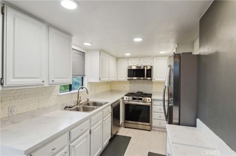 Photo of 8710 Independence Avenue #301, Canoga Park, CA 91304 (MLS # SR26035427)