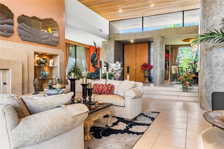 Welcome to this amazing architectural masterpiece set in one of the most prestigious and well planned clubs in the desert. Ironwood country club is filled with lush greens, beautiful golf course, tennis and dinning right at your fingertips. This home is perched on a very large corner lot with lavish landscaping, wrap around yard with multiple patios on every room as well as a beautiful private Jacuzzi. Community pool is only steps away through property rear gate. As you enter the solid wood door entry you are taken back by the tall 20 foot soaring ceilings that grace the living room adorned by magical works of art some of which can be included in the sale. In every direction is well thought out artistic perfection in the design and layout of the home. Beautiful fireplace in Master bedroom. Completely gutted and re imagined less than 10 years ago. Each room as you pass through in the home is decorated with passion sophistication and is included in the sale. Inventory list will be provided. Amazing views in every direction this home is a perfect retreat for the part time or full time resident. Paid for solar is an amazing benefit in the desert. Come see yourself in this gorgeous home.