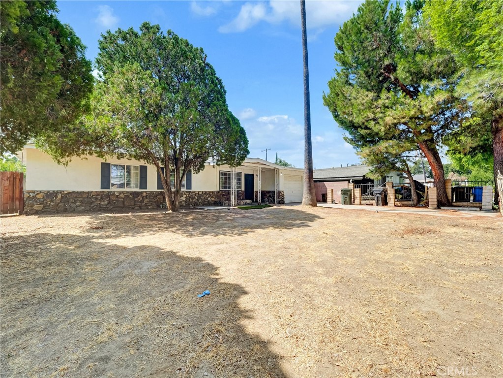 This spacious 4-bedroom, 2-bath home offers comfort, convenience, and potential. Recently upgraded with a modern kitchen and refreshed bathrooms, the home blends contemporary updates with room for your own finishing touches—perfect for making it uniquely yours.
Enjoy the security of a gated property and the rare functionality of a garage with doors on both sides, creating easy access straight into the backyard. Tucked into a quiet, established neighborhood, this property offers both peace and practicality.