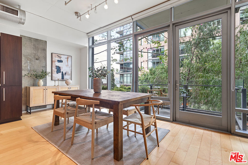 Now priced to sell. Summer in the City with a Peaceful, Green Retreat. Embrace the best of downtown living in this priced-to-sell 1-bedroom, 1-bath loft at the sought-after Luma South Lofts- South Park's premier mid-rise in the heart of vibrant Downtown LA. With 917 sq. ft. of bright, open space, soaring ceilings, and an entire wall of floor-to-ceiling windows, this home is designed for both style and comfort.From your rare private balcony, soak in serene views of lush treetops and the sparkling pool on the amenity deck below a refreshing, resort-style escape that feels worlds away from the city bustle. The greenery, open sky, and inviting pool create a homey, summer-perfect vibe right outside your door.Inside, you'll find a spacious walk-in closet, large bath, and the convenience of in-unit laundry. Luma South Lofts is LEED Gold-certified and impeccably maintained, offering 24/7 concierge and security, a modern fitness center, spa, pool, and sundeck with multiple grills for warm-weather gatherings.With secure garage parking, major utilities (except electricity) included in the HOA, and a location steps from Whole Foods, LA Live, the Crypto.com Arena, Target, Zara, and top dining spots, this is downtown living at its most vibrant. Don't miss this opportunity priced to sell and ready for its next owner.