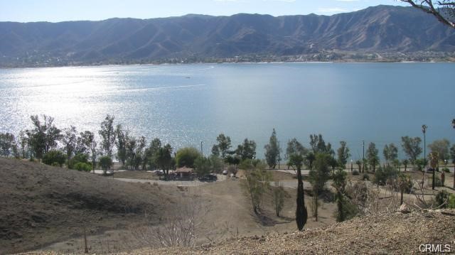 INVESTMENT LOT IN COUNTRY CLUB HEIGHTS, LOCATED ON PAVED STREET WITH FANTASTIC LAKE AND MOUNTAIN VIEWS. DOWNSLOPE. WATER CO. SAYS WATER IN STREET. CLOSE TO BREDLAU CASTLE. BUYER TO CHECK WITH PERTINENT AGENCIES REGARDING ZONING, UTILITIES AND BUILDABILITY