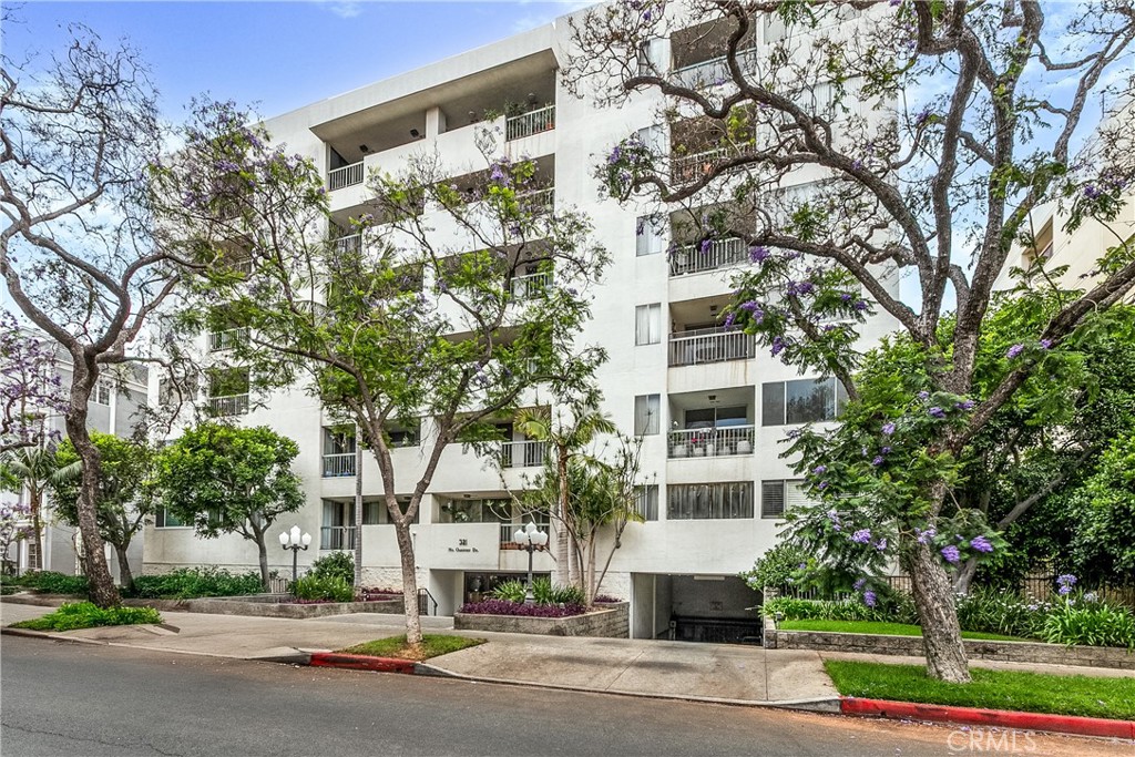 RARE FIND! Welcome to the largest one-bedroom, 2-bathroom unit you'll find in Prime Beverly Hills with incredible potential.
An extraordinarily spacious home that redefines luxury living with room to breathe, live, and grow. This isn't your typical cramped one-bedroom; the generous proportions and thoughtful layout provide more living space than many two-bedroom units in the area, complemented by an almost unbelievable amount of built-in storage throughout plus two tandem parking spots (rare for a one-bedroom) and four additional locked storage units that eliminate the need for external storage. This rare front-facing unit boasts a large balcony with unobstructed street views of the beautiful wisteria trees, while the spacious kitchen features stainless steel appliances and the convenience of in-unit laundry adds to the appeal. The spacious den includes a wet bar and already features a bathroom and walk-in closet – many residents have successfully converted this space into a second bedroom, instantly transforming this into a two-bedroom layout. Located in prestigious North Beverly Hills, you're moments from Beverly Hills City Hall, Cedars-Sinai Medical Center, world-famous Rodeo Drive, and the finest shopping and dining LA has to offer, with children eligible for the highly-rated Beverly Hills Unified School District. Building amenities include a resort-style pool, fully-equipped gym, BBQ area, recreation room, elegant lobby, and weekday concierge security. This unit features original finishes waiting for your personal vision – priced competitively to sell, this represents a rare chance to create your dream home while building substantial equity. Perfect for investors seeking value-add opportunities, buyers wanting to customize their space, or anyone looking for exceptional square footage at an unbeatable Beverly Hills price point. Bring your contractor, your creativity, and your vision – the bones are excellent, the location is unmatched, and the opportunity is now.