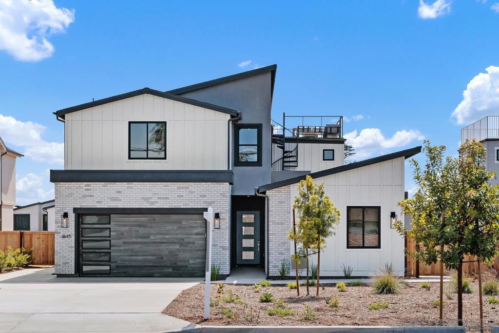 LAST HOME IN 8 Pacific! Ideally located in the highly sought after Fire Mountain neighborhood, close to downtown Oceanside, Carlsbad Village, with easy access to the freeway, and just over a mile from the beach, these stunning homes are in a prime location. This gorgeous coastal contemporary home features high-end finishes and appliances, hardwood flooring, high ceilings, and large black framed windows throughout which flood the home with natural light. The impressive kitchen opens up to the great room, and leads out to the spacious, ocean view backyard through a large slider, perfect for California indoor-outdoor living. The main floor features an office as well as a self-contained 1 BR ADU, with a separate entrance. The second floor boasts a primary ocean view bedroom with luxurious en suite bath. There are three secondary bedrooms, and a conveniently located laundry room. The home is crowned by a rooftop terrace, the perfect place to watch the sunset over the Pacific Ocean.