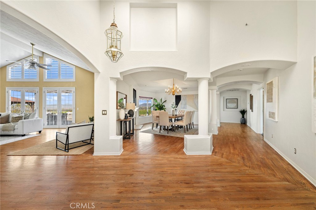 Stunning Panoramic Views | Private Gated Entry | High Ceilings | Amazing Floor-plan… You won’t want to miss this one! Welcome to your dream retreat in Glenoak Hills, nestled in the heart of Temecula Wine Country. This stunning custom home sits elevated on nearly 5 acres, offering truly breathtaking panoramic views of both sunrise and sunset—visible from nearly every room in the house. With 4,215 square feet of living space, the home features 4 bedrooms plus a generously sized bonus room with its own private bathroom, ideal for guests or a home office. The open floor plan boasts soaring ceilings, large windows, and a timeless custom design that creates a warm and inviting atmosphere. Surrounded by dramatic natural boulders and beautifully manicured landscaping, the home offers gated, private access and a spacious 3-car garage. The formal living room features vaulted ceilings and a fireplace that frames the stunning views of nearby wineries and rolling vineyard hills. A large formal dining room and an open-concept kitchen make entertaining a breeze. The oversized primary suite is a true sanctuary with eight windows, double French doors, a vaulted ceiling, and an expansive walk-in closet. The spa-like primary bathroom includes a soaking tub, walk-in shower, and separate vanity area. Step outside to your private backyard oasis, complete with two covered patio areas, a built-in BBQ, and a scenic deck perfect for soaking in vineyard views and wine country sunsets. With solar, plenty of space for future additions or hobbies, and a location just minutes from wineries, shopping, and within the award-winning Temecula school district—this home offers the ultimate blend of luxury, privacy, and lifestyle.