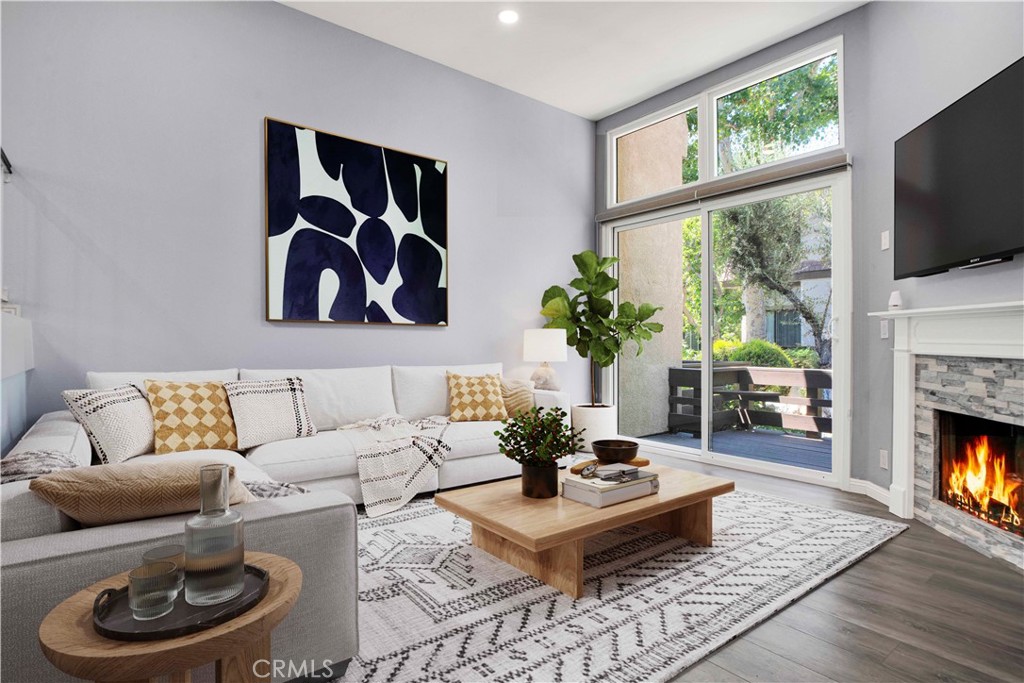 LOCATION, LOCATION LOCATION! Welcome to this gorgeously remodeled Northbrooke townhome! The unit boasts 2 large suites, 3 baths, private 2 car garage, and is tucked deep within the complex, entering through the treelined walkways, alongside the flowing water feature. This light & bright tri-level home has an open floorplan with vaulted ceilings & clerestory windows that bring in natural light throughout the day. Stylish combinations of modern elegance from the chic chandelier in the 2 story entry; to the sleek stainless steel appliances, quartz countertops & marble subway backsplash in the kitchen; with classic backdrops of paint color throughout the home to compliment any design. Modern features include: smooth ceilings, recessed lighting, custom zebra blinds & luxury vinyl plank flooring throughout. Upgrades include: brand new dual pane windows & whole-house water filtration system. The spacious lower level living room has a corner fireplace with stone tile & wood mantle. Enjoy coffee, drinks or entertaining on the lush patio-- which sits above the green space path & shaded by surrounding trees. The upper living-dining room & kitchen level has a built in coffee/bar with sink & additional built-ins in the dining area offer abundant storage options. This flex space level is large enough to have an extra sitting area, which makes it great for entertaining. The huge primary suite has a treetop view, accent wall, desk niche, modern ceiling fan/light, an extra large closet & a secondary closet. The spa-inspired primary ensuite features dual vanities, glass enclosed rainfall shower & handheld fixtures, high end tile finishes with corner bench seat, & brushed nickel hardware. The guest suite has large closet & a full size ensuite. This secondary bath features classic subway tile surround, waterfall & handheld fixtures, modern vanity & lighting with brushed nickel hardware. Enjoy resort-style amenities, including a sparkling pool, garden jacuzzi, tennis courts, meandering water features, guest parking. Northbrook's HOA covers 24 hour Security, water, sewer, earthquake insurance; other mentionable items: earthquake retrofit done in 2020 & a new roof done in 2023. Located in the heart of Northridge-- easy freeway access for commuters; minutes from Porter Ranch, CSUN, Northridge Fashion Center, Porto's Bakery, Costco & MORE! Great opportunity to own this townhome; it feels more like a home in a nice neighborhood-like community. Schedule your private showing today!
