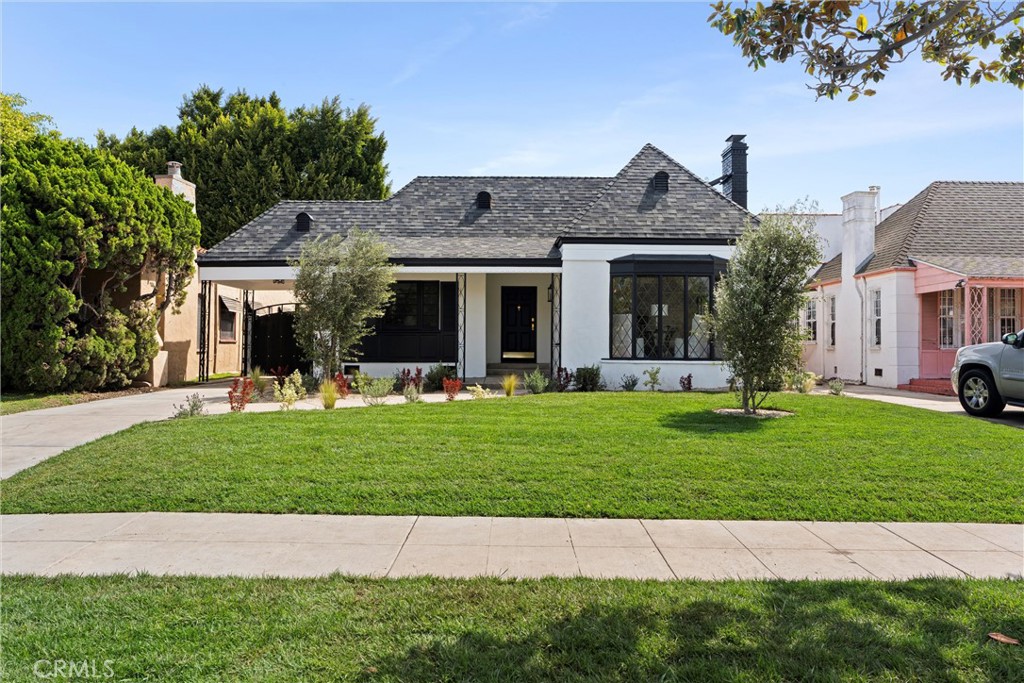 Welcome to 158 S Formosa Avenue, a rare reimagined traditional home nestled within a tranquil tree-lined street in the highly desirable Miracle Mile North Historic Preservation neighborhood. A Beautiful exterior color palette and succulent landscaping greet you upon arrival. Step inside and be captivated by the warm attention to detail, restoration, and creation of era style elements. The thoughtfully designed open-concept floor plan features a large gourmet kitchen perfect for culinary enthusiasts, complete with top-of-the-line custom matching appliances, quartz counters, white oak cabinetry, large Apron sinks, floating shelves and designer light fixtures. All overlooking the tranquil dining area. Your beautiful re-inspired living room features a stand out quartz fire place, custom crown molding, a historic timeless front bow window with leaded glass and French oak floors throughout. Parallel to the living room is your first bedroom, this could be converted very simply by the contractor into a den or your own private dining area if preferred. The large primary bedroom & bathroom features a double reeded vanity, standalone tub, walk in glass shower, large format designer tile, walk in closet, separate smaller closet and French doors leading out to a large wrap around deck. The other 3 bedrooms have ample space, closets and one of the bedrooms has french doors also leading out to the deck. The other two bathrooms have a mixture of marble vanities. Delta shower finishes, herringbone porcelain floors and brass hardware. The ADU has its own kitchenette, bathroom with walk in shower and hardwood floors, perfect for a at home office, studio or in-law suite. The ADU also features it's own address, gas & electric meter and tankless water heater. The grounds feature an enclosed new wood & iron gate, drip system, lush olive trees, a new large wooden deck perfect for hosting outdoor gatherings for al-fresco dining and entertaining. All new wooden privacy fencing, mature plants & trees, gravel and concrete. Upgrades include foundation, roof, furnace, plumbing, electrical, tankless water heaters, sewer, chimney, stucco, windows, doors, flooring, kitchen, bathrooms, bedrooms, living areas, landscaping and hardware. Highly sought after location, centrally located to schools, shopping and places of worship. *Seller open to buying down buyers interest rate*