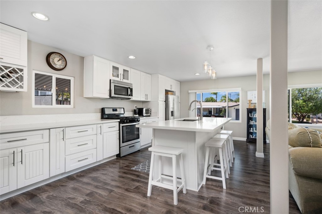 UPDATED & MOVE IN READY! Located in the Golf Knolls 55+ Active Senior Community, this manufactured home is ready for you to enjoy. The Open Floorplan gives this home a very spacious feel. Light & bright w/ neutral colors throughout. The all white, updated kitchen is the star of the show w/ the large center island, quartz countertops, stainless appliances & the abundance of cabinetry. The Lg living room space has plenty of areas to sit and spread out + areas for informal and formal dining. Warm tone wood laminate flooring all throughout the home. Ceiling fans in the bedrooms. Remodeled bathrooms adjoin both bedrooms. The primary bedroom suite is spacious w/ ensuite bathrm including a spacious walk-in shower, dual sinks & walk-in closet. Spacious shaded, private patio offers the perfect area for outdoor enjoyment and is low maintenance + the added privacy of no direct neighbors behind. This property has not only been updated with the finish work inside, but sooooo many other parts of a home have been replaced, that are important to maintain; New Roof, New Electrical, New Windows, New HVAC, New Water Heater, New Ceiling, New Deck Entry, New Retaining Wall, New Foundation Work; thus, the big stuff has been done for you! All you need to do now is move in and enjoy. Golf Knolls offers so many activities if you are looking for social fun. Great location in Murrieta, close to everything! Come check out this home & Community you won't be disappointed.