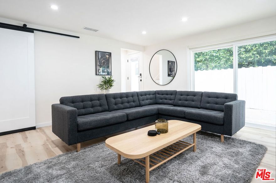 This exquisite residence in highly sought after area in WeHo showcases 3 spacious bedrooms and 2.5 elegant bathrooms, including a luxurious primary suite with a walk-in closet and dual vanity sinks. The chef's kitchen is designed for entertaining, featuring a central island with wine cooler, premium finishes, and open flow to the living spaces. A dedicated office provides the perfect work-from-home setup, while multiple private outdoor areas with abundant seating offer the ideal retreat for relaxation or gatherings Including private balcony and covered patio. Furnished and unfurnished options available. Additional highlights include a storage shed, 2 on-site parking spaces, and a generously sized upstairs balcony adjoining two well-appointed bedrooms and a full bath. This home blends modern comfort with thoughtful design, creating a truly exceptional living experience.