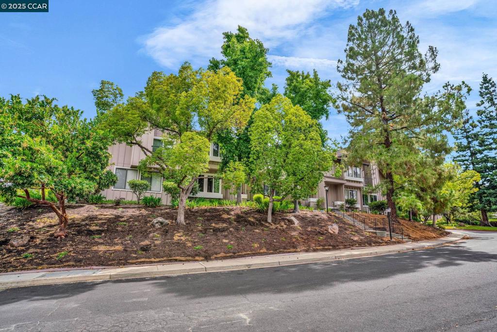 Welcome to this beautifully maintained townhome offering 3 spacious bedrooms and 3 full bathrooms—including a convenient bedroom and full bath on the first floor, perfect for guests or multigenerational living. Street-level access from your private 2-car garage that leads you to a lovely serene patio with paver stone is ready for you to relax and to entertain. Great Location! Just minutes from downtown, major freeways, BART, top medical facilities, shopping, parks, and scenic trails—this home puts everything within easy reach. The heart of the home is the fabulous eat-in kitchen, featuring granite countertops, a stylish tile backsplash, stainless steel appliances, a 5-burner cooktop, and ample maple cabinetry for all your storage needs. A charming bay window fills the space with natural light. Entertain with ease in the open-concept living and dining area, complete with beautiful wood flooring, recessed lighting, a designer light fixture, dual-pane windows, and A/C—all with serene views of surrounding trees. HOA offers community pool , club house and trails. New carpet, fresh paint, finished garage with epoxy floor and storage area. No rental restrictions.