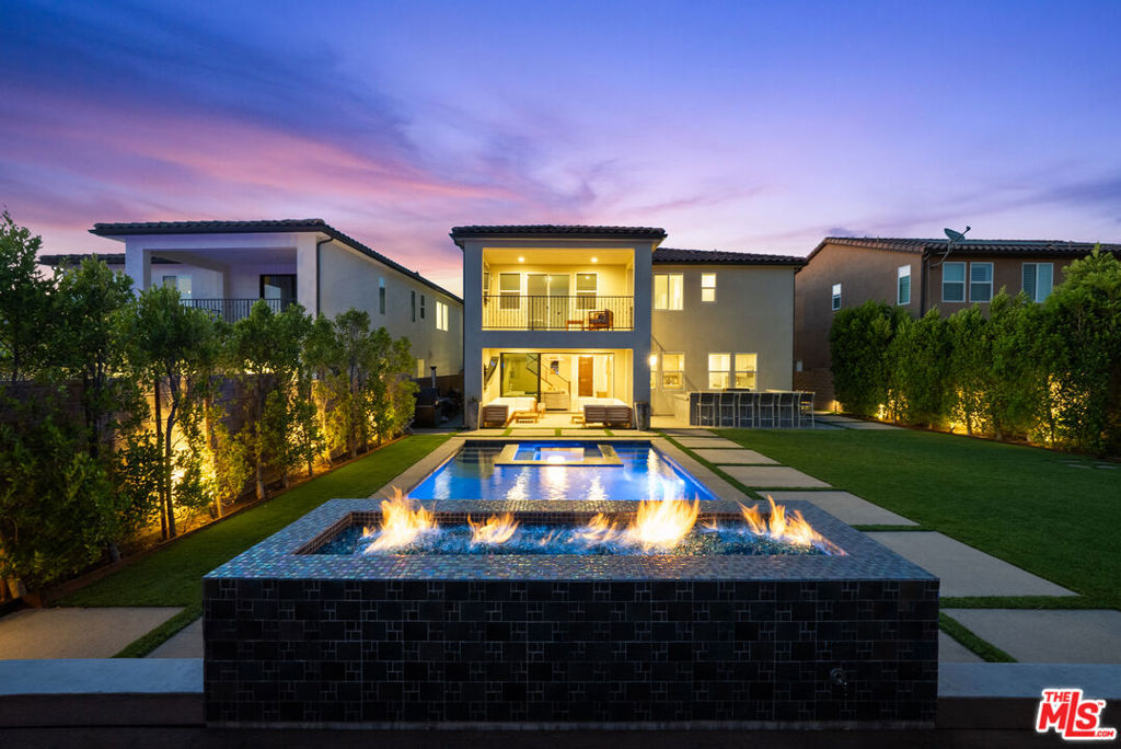 Welcome to 18952 Lauren Lane, a beautifully designed 5-bedroom, 4-bathroom home built in 2019, offering nearly 2,900 square feet of thoughtfully planned living space. This modern residence features an open-concept floor plan with a spacious great room, dining area, and a gourmet kitchen equipped with stainless steel appliances, quartz countertops, and a large center island perfect for gatherings.The main level includes a flexible bedroom/office and full bath, ideal for guests or working from home. Upstairs, the expansive primary suite boasts a spa-like bathroom with dual vanities, soaking tub, walk-in shower, and a generous walk-in closet. Additional bedrooms provide comfort and versatility for family or lifestyle needs.Step outside to a private backyard ready for entertaining, dining al fresco, or simply enjoying California evenings. Situated in a newer Santa Clarita community, this home offers modern amenities, energy efficiency, and close proximity to parks, top-rated schools, shopping, and dining.Experience the perfect balance of style, function, and convenience in one of Santa Clarita's most desirable neighborhoods.