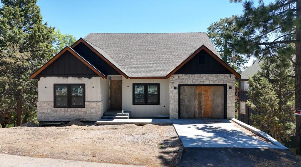 Unlock the potential of this massive 4,900 sq ft mountain home located in the highly desirable Moonridge area! With 5 spacious bedrooms and 3 bathrooms, this unfinished property offers a rare opportunity to add your personal touch and build instant equity. All the heavy lifting has been done -- all that's left is drywall, paint, fixtures, , flooring and decking, etc. Whether you're dreaming of a luxurious full-time residence, vacation rental, or multi-family retreat, this property is a blank canvas waiting for your vision. Just minutes from Bear Mountain Ski Resort, the golf course, zoo, and forest trails. Don't miss out on one of the largest homes available in Big Bear City -- bring your contractor and make it your own! No financing available. Cash or Hard Money only.