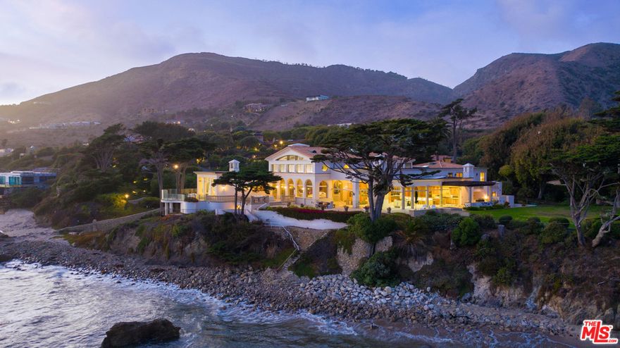 Once in a lifetime a property comes on the market that transcends the epitome of Malibu living. For the first time ever this Malibu Oceanfront Landmark Estate has become available. Enter through your private gates to this Magnificent Villa on 281 ft +/- of ocean frontage. 10 lots totaling approximately 1.56 acres. The Private Villa encompasses 10,500 sq ft of luxury living on 3 levels. Massive high ceilings throughout all the main entertaining spaces with walls of glass to gaze out to the whitewater and sunset vistas yet at the same time affording complete privacy from the beach below. Master Suite with whitewater and sunset views down the coastline. The oceanfront massive wrap around terrace is completely private from public eye and has a private staircase to the beach and sand below. Other amenities include 3 upstairs ocean view bedroom suites with a large guest terrace, basement includes wine cellar, game room, space for a home theatre, gym and direct access to the beach for your morning jog.