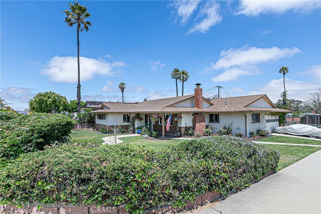 This bright and cheerful 3-bedroom, 2-bath home in the heart of Orcutt features an open floor plan and a spacious kitchen—perfect for family gatherings and entertaining. The home is filled with natural light, highlighted by a huge front window overlooking the beautifully maintained front yard. Enjoy the comfort of newer Luxury Vinyl Plank flooring and fresh interior paint through some of the home. A bonus structure offers the perfect space for a home office, art studio, workshop, or whatever suits your lifestyle. The expansive backyard is a true highlight—offering RV parking, room for a possible ADU, garden beds, or 4H projects. Mature fruit trees add charm and provide fresh seasonal produce. Located near Orcutt schools, parks, and shopping, this home combines convenience with endless potential.