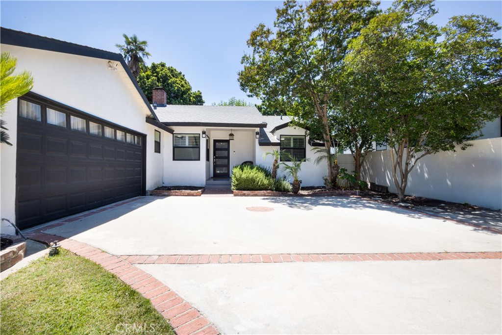 Turnkey Tarzana Home with separate studio unit to rent out or use as another functional living space! Assumable loan with low interest rate. Looking for a smart investment or the perfect live-and-rent opportunity? This unique 4bed 3bath property offers two dwellings on a spacious, landscaped lot with ample on-site parking. The newly renovated rental unit can generate $2100/month while the main modern style home is ideal for an owner occupancy or additional rental potential. 1 The main house features 3bedrooms and 2 beautifully updated bathrooms, combining classic charm with thoughtful modern upgrades — including an updated kitchen with JennAir stainless steel appliances package, custom cabinets, new energy-efficient windows., tankless water heater, and smart home technology. 2. Connected to the main house, with its own private entrance, is a designer studio unit complete with a modern 1 full bathroom, stainless steel kitchenette, quartz countertops, and separate mini split AC— perfect for short- or long-term tenants. Surrounded by vibrant flowers, in ground Jacuzzi, and landscaping, the outdoor space is as inviting as it is low maintenance. Live in one, rent the other. Opportunities like this don’t come often. Schedule a tour today!