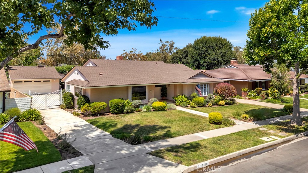 WEST FLORAL PARK SHOWCASE SINGLE-STORY RANCH-STYLE HOME. BUILT IN 1958, BUILT BY ROGERS, A HOUSEHOLD NAME IN FLORAL PARK, THIS HOUSE HAS ALL THE CHARM OF THE PERIOD BUT METICULOUSLY REMODELED FOR THE FUTURE. YOU CAN JUST MOVE RIGHT IN AND ENJOY THE SERENE BEAUTY OF THE NEIGHBORHOOD. FORMAL ENTRY LEADS TO A LARGE KITCHEN FEATURING LOTS OF WINDOWS TO LET THE LIGHT IN, AN EATING AREA, PERFECT FOR THE HOLIDAYS AHEAD. THE REMODELED KITCHEN HAS BEEN CAREFULLY PLANNED, FEATURING ANTIQUE WHITE CUSTOM CABINETS WITH BLACK GRANITE COUNTERTOPS. MEALS MADE EASY WITH THE THERMADOR STAINLESS 4 BURNER GAS STOVE WITH CENTER GRILL AND AN ELECTRIC OVEN. THERE IS A COMMERCIAL GRADE RANGE HOOD TO KEEP THE KITCHEN COOL AND THE FOOD HOT. PERFECT FOR THE CULINARY CHEF. APPLIANCE GARAGES KEEP THE SMALL ITEMS OUT OF SIGHT BUT CONVENIENTLY ACCESSIBLE. BUILT-IN KITCHENAID REFRIGERATOR/FREEZER, DISHWASHER AND MICROWAVE. A CONVENIENT LAUNDRY ROOM HAS LOTS OF STORAGE, A WASH SINK AND A DUTCH DOOR OUT TO THE DETACHED 2 CAR GARAGE AND PARK-LIKE REAR YARD. THE FORMAL LIVING ROOM HAS A WOOD BURNING FIREPLACE. LARGE CUSTOM ETCHED PICTURE WINDOW OF THE BEAUTIFUL LANDSCAPE AND CUSTOM RECESSED LED LIGHTING TO ACCENT THE ROOM. A HALL FULL OF STORAGE LEADS TO THE BEDROOMS. THE PRIMARY BEDROOM HAS A PICTURE WINDOW WITH PLANTATION SHUTTERS AND A DOOR OUT TO A COVERED PATIO TO ENJOY YOUR MORNING COFFEE. A HOT JUST LARGE BUT EXTRA LARGE CLOSETS WITH CUSTOM BUILT-INS AND A WINDOW TO LET NATURAL LIGHT IN. THE PRIMARY BATH HAS VAULTED CEILINGS, CUSTOM WINDOWS, DUAL SINKS AND CUSTOM CABINETS. THE CUSTOM SHOWER FEATURES DUAL SHOWER HEADS, DUAL BENCH SEATS CUSTOM TILE AND GLASS, WHAT A WAY TO START THE DAY! THE OTHER BATH IS OFF THE ADDITIONAL BEDROOM THAT FEATURES A CUSTOM COUNTERTOP WITH A BASIN SINK, AND FULL BATH. THERE IS A LONG DRIVEWAY THAT LEADS TO A 2 CAR DETACHED GARAGE. 2 COVERED PATIOS, ONE OFF THE PRIMARY BEDROOM AND THE OTHER OFF THE GARAGE THAT HAS AN OUTDOOR KITCHEN TO ENJOY THE MATURE LANDSCAPE AND BEAUTY OF THE REAR YARD. NO NEED TO VACATION, YOUR RETREAT IS IN YOUR OWN BACKYARD UNDER THE QUEEN PALMS, NIGHT BLOOMING JASMINE, PINK LADIES AND YOUR OWN LEMONADE TREE!