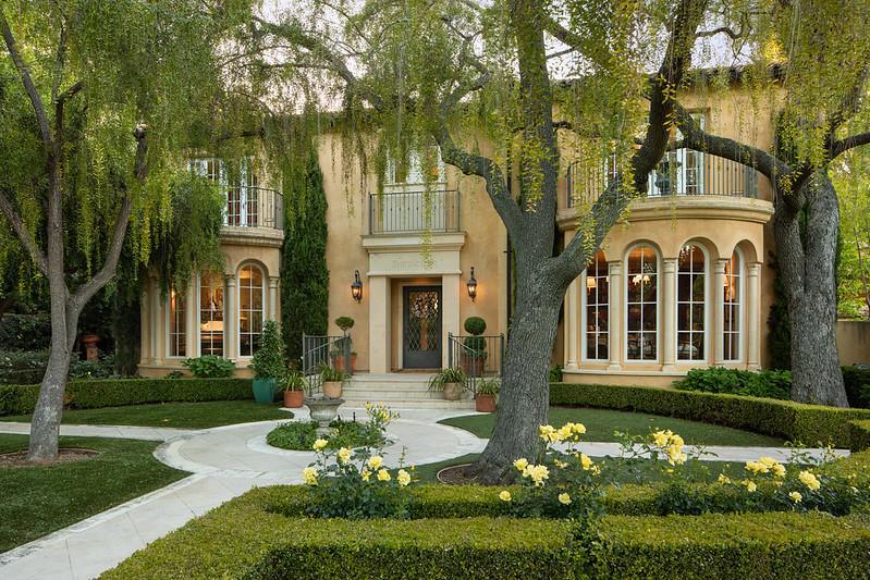 Experience European elegance on one of Palo Alto's most premier streets. The home was meticulously remodeled in 2009 by DeMattei Construction. Preserving its original charm, circa 1927, it has features like richly hued hardwood floors, towering arched windows, and 7 fireplaces. The 3-level main home, with elevator, has 4-en suite bedrooms one which is being used as an office. The primary suite has a gym, sauna, and separate washer/dryer. The kitchen has a French La Cornue range. There is a separate 1-bedroom guest house with full kitchen. There is a handsomely appointed library with bookcases and a secret door into the dining room. The lower level has 3 temperature controlled wine closets, plus a recreation room with bar. The outdoor space is wonderful for entertaining with a stunning pool inspired by Hearst Castle with hand set Morano tiles, vast antiqued limestone terrace, and professionally landscaped gardens on more than one-half acre. With its prime Crescent Park location, minutes to shops on University Ave, as well as acclaimed Palo Alto schools, this property offers the perfect blend of old-world elegance and luxurious modern comfort.