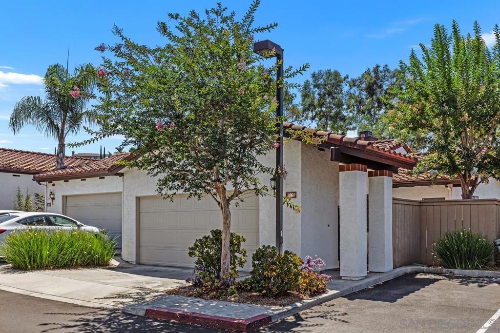 Enjoy panoramic vistas and spacious living in this beautiful twinhome located in the desirable and centrally located Murray Ridge community of La Mesa, just minutes from the highly rated Helix High School. This home lives like a detached single-family residence and offers a blend of comfort, privacy, and style. Step into the inviting, fully fenced front courtyard, perfect for entertaining or unwinding with a view. Inside, you’ll find vaulted ceilings, abundant natural light, and a thoughtful open-concept layout enhanced by hardwood floors (2022). The first floor has been freshly painted and features a bedroom and a full bathroom. The kitchen is designed for both function and style, with granite countertops, ample prep space, new faucets, and an ideal layout for hosting guests or preparing meals. Step onto the wide balcony to enjoy stunning park-like views, with clear-day glimpses of Mexico and the bay. Downstairs, the primary suite and an additional bedroom both open to a private lower patio and fully fenced backyard oasis, which includes **nine trees—four of them fruit-bearing—**and a recently updated irrigation system. The oversized 2-car garage features built-in cabinets, a sink, and attic access via a retractable ladder, and could potentially be remodeled into an additional bedroom or ADU, if desired. SEE SUPPLEMENT FOR MORE INFO. The community offers ample unassigned parking and a low monthly HOA fee of $315, which includes water, trash, landscaping of common areas, and insurance. With roof replacements completed in 2019 and 2022, this turnkey home provides peace of mind and long-term value. Located near the Village of La Mesa, Downtown San Diego, South Bay, North County, and the coast via easy access to the 94 and 125 freeways. It’s more than home. It’s a lifestyle!