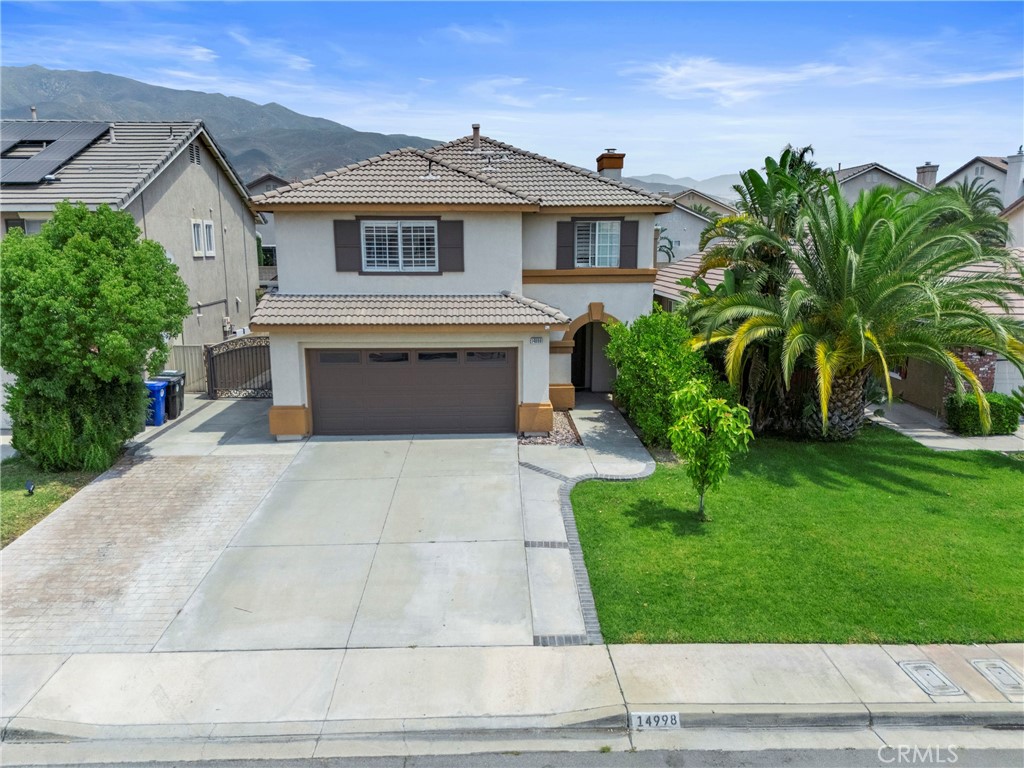 Welcome to this 3-bedroom, 2.5-bath home in the desirable Hunter's Ridge neighborhood of Fontana. With 1,629 sq. ft. of thoughtfully designed living space on a generous 5,166 sq. ft. lot, this home blends modern convenience with timeless charm. Step into a bright and open floor plan featuring soaring ceilings, a cozy fireplace, and eye-catching metallic flooring—known for its sleek, lava-like aesthetic and durability.The kitchen features a central island with a decorative olive corbel that harmonizes with the warm tones of the cabinetry and overall ambiance—creating an inviting space perfect for gatherings. Unwind in your master suite, featuring a walk-in closet and a private en-suite bath. The two additional bedrooms are connected by a convenient Jack-and-Jill bathroom, making this layout ideal for families or guests. Enjoy energy savings year-round with paid-off solar, offering both efficiency and peace of mind. Outside, you'll find mature fruit trees, an above-ground spa, and room to entertain. The tile roof, security system, and RV-parking add to the home’s practicality, while the 2-car garage offers additional storage and convenience. Located just minutes from San Sevaine Park, Hunter’s Ridge Park, Sierra Lakes Golf Club, and Victoria Gardens Mall, this home also enjoys quick access to major freeways. Don't miss the opportunity to own a unique home in one of North Fontana’s most sought-after neighborhoods.