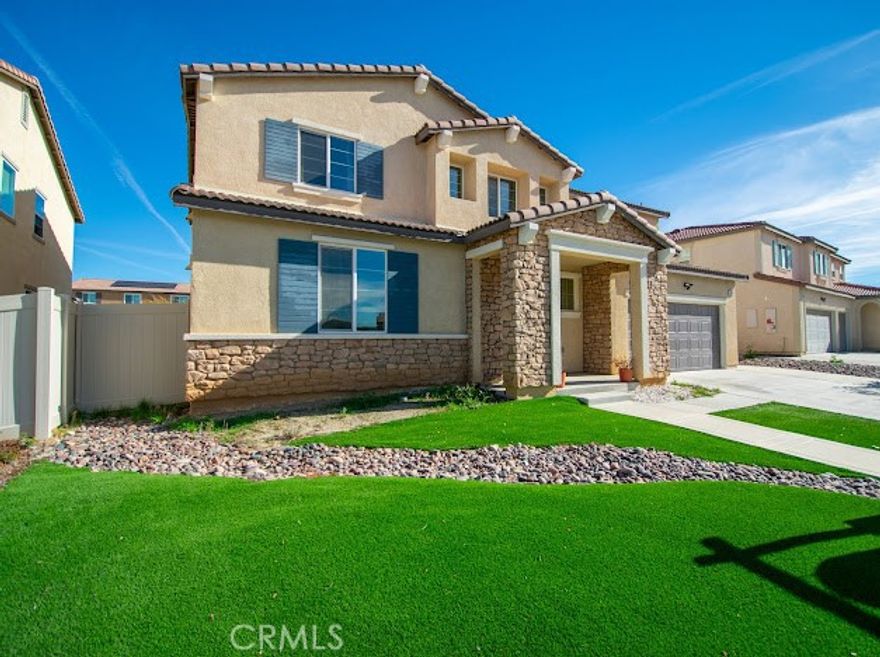 Spacious 3013 sq ft 5 Bedroom, 3 Bath, open floor plan home on a premium size lot located in the gated Community of Olivewood. This beautiful home features, large island with bar seating, walk in pantry and stainless steel appliances in the kitchen, a bedroom and full bath on the main floor, tandem 3 car garage with a side door to the backyard. On the second floor you will find a large loft, laundry room, the main bedroom with dressing area, walk in closet, linen closet, separate vanities, three additional bedrooms plus a second full bath. This home is located near the 10/60 fwy and shopping. Enjoy the resort style HOA amenities which include, pool and spa, splash pad, community park, picnic area, basket ball court, walking trails and clubhouse. This beautiful home comes with PAID SOLAR!