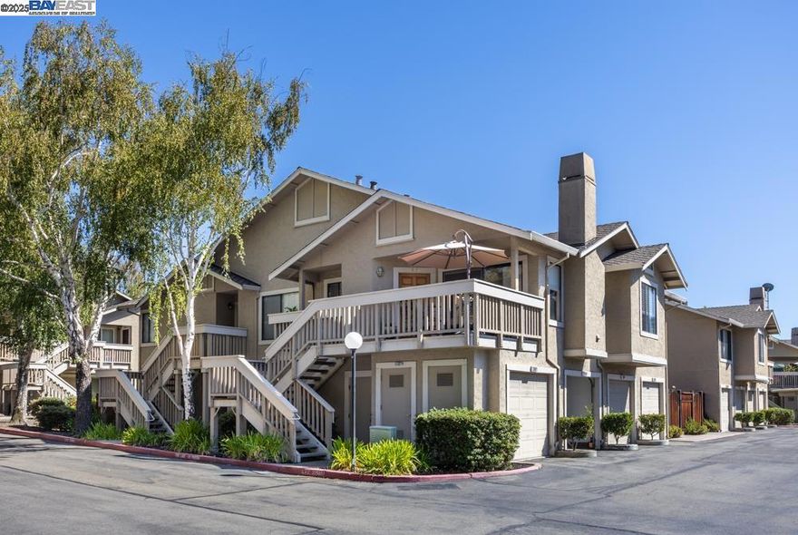 Welcome to this beautifully maintained top floor corner unit in San Ramon’s prestigious Cobblestone community. Tucked away with its own private entrance and oversized deck, this 2-bedroom, 2-bathroom home offers a rare combination of privacy and charm.  Step inside to find elegant hardwood floors, recessed lighting, and an updated granite kitchen with modern backsplash. Both bathrooms have been remodeled, offering comfort and style throughout.  The spacious living area flows seamlessly to the large private deck—perfect for enjoying a quiet morning coffee or hosting friends on warm evenings. Additional highlights include in-unit laundry in the attached 1-car garage.  Conveniently located near the community gate with easy guest parking, and just minutes from top-rated schools, shopping, dining, and freeway access—this home brings together lifestyle and location in one beautiful package.