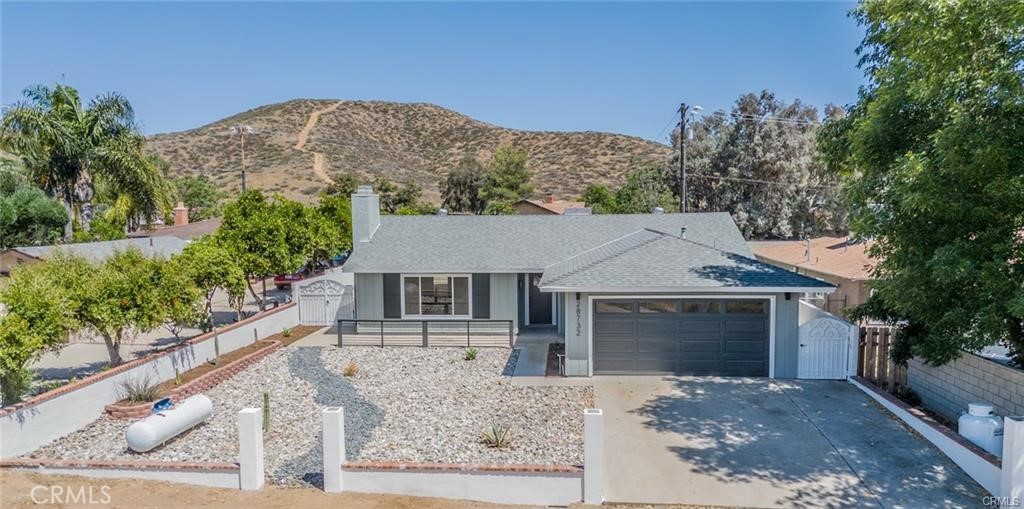 Welcome to Your Ideal One-Story Pool Home in Menifee! This beautifully upgraded residence offers the perfect blend of style, comfort, and functionality—ideal for creating lasting memories. Situated on a spacious 9,148 sq. ft. lot, the home features three generous bedrooms and two tastefully remodeled bathrooms.Step inside to discover an inviting family room with abundant natural light and a cozy fireplace. The home boasts new laminate wood flooring throughout the main living areas and new carpet in the bedrooms. Additional upgrades include new ceiling fans, recessed lighting, and freshly painted interior and exterior. The updated kitchen is a chef’s dream, featuring newly painted cabinets, new quartz countertops, a stylish tile backsplash, and all-new stainless steel appliances, sink, recessed lighting, and fixtures. Both bathrooms have been modernized with new vanities and contemporary shower designs.Enjoy the Southern California lifestyle in your private backyard oasis—complete with a sparkling pool, patio cover, and plenty of space to relax, entertain, and host family gatherings. The attached 2-car garage provides added convenience. This home offers proximity to shopping and dining at the Menifee Countryside Marketplace, as well as top-rated schools. Outdoor enthusiasts will love the nearby hiking trails, the Motte Rimrock Reserve, and options for camping, fishing, and horseback riding.This home truly offers comfort, convenience, and a vibrant community lifestyle. Don't miss out—schedule your showing today!