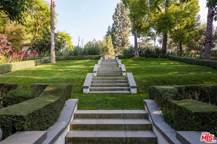 The one and only historic Cecil B. DeMille Estate.  Set on 2.1 elevated acres in prestigious Gated Laughlin Park.This multi-structure compound consists of a spectacular Beaux Arts Style mansion built in 1913, a beautiful pool house and a studio house with a separate entrance.  A six-year renovation/restoration sensitive to original details yet including modern amenities has created a high-quality sophisticated environment rarely seen. Gated and walled with incredible gardens, paths and sitting areas. A newer classic old Hollywood style pool with arched fountains, surrounded by rolling lawns, specimen trees, rose gardens and dramatic views from the Observatory to Ocean sunsets.