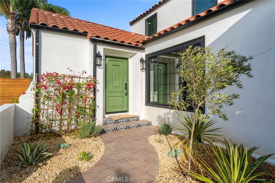 Welcome to a masterfully restored Spanish-style sanctuary in the View Park neighborhood, where old-world charm seamlessly blends with contemporary convenience. This special home greets you with an inviting terracotta-tiled front porch, perfect for sipping your morning coffee in the sun. Step into the expansive living room, bathed in natural light and rich with character, featuring a classic fireplace adorned with vintage Batchelder tile.

The heart of the home is a chef’s dream kitchen, boasting custom cabinetry, quartzite countertops, designer backsplash tile, and brand-new appliances to elevate your culinary experience. The second floor offers two light-filled primary suites, each with luxurious retreat-style bathrooms and modern lighting. Two additional bedrooms on the first floor provide versatility and ample space, sharing a beautifully appointed second bathroom with custom tile finishes.

The backyard is an entertainer’s paradise, offering multiple options for hosting, with fresh landscaping and a large deck ideal for al fresco dining or twilight gatherings. The two-car garage provides coveted bonus space, perfect for a gym, home office, or potential ADU conversion. Ample parking is available in the driveway, with room both in front of and behind the gated entry.

Additional improvements include updated plumbing and electrical systems, a new roof, new driveway, new HVAC, and new windows.

Enjoy close proximity to Downtown Los Angeles, Leimert Park Village, SoFi Stadium, Downtown Culver City, Playa Vista, West Adams, and one of LA’s most beloved green spaces, Kenneth Hahn Park. You’re also near local favorites such as Jon & Vinny’s, Helen’s Wines, Hilltop Coffee + Kitchen, Simply Wholesome, the Culver City Stairs, and more. This exceptional home has been waiting for you and is truly a must-see to appreciate!