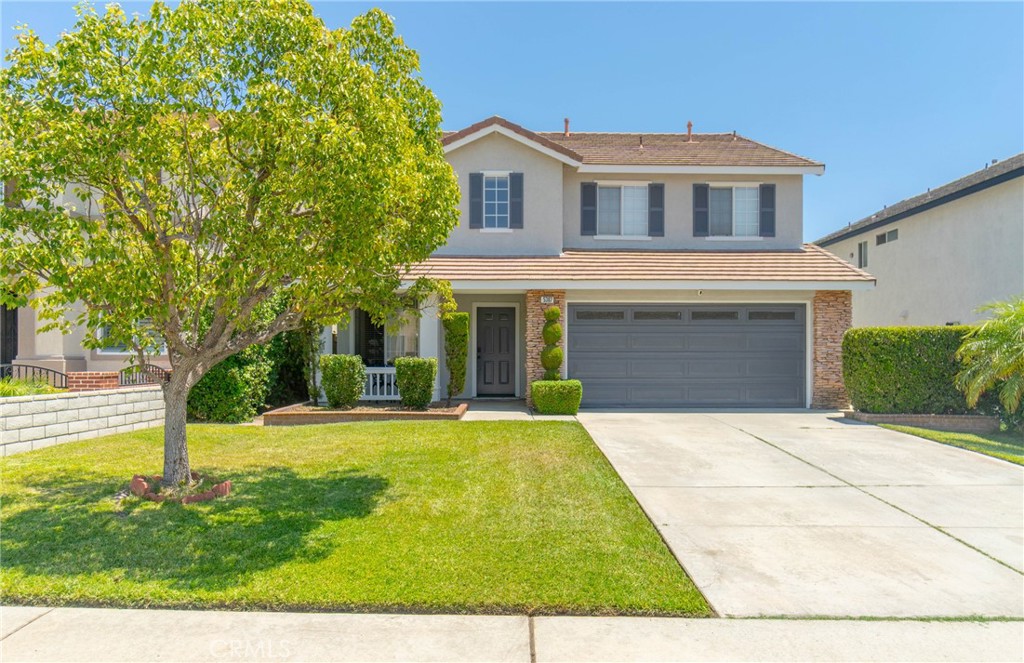 Welcome to the desired community of Hunter’s Ridge located in The City of North Fontana! This beautiful home is open and airy with a dramatically high two-story ceiling over the formal living and dining area, and ample natural light throughout. Enjoy the toasty fireplace with a stacked stone facade in the spacious family room, which opens to the kitchen featuring ample storage, a breakfast island, granite counter tops, stainless steel appliances, and a sliding glass door to the patio. You’ll find contemporary LVP flooring on the main level and plush carpeting in the bedrooms. In the primary suite, enjoy the vaulted ceiling, walk-in closet, soaking tub, separate shower, double sinks, granite vanity, and a private toilet door. The exterior has been freshly painted in beautiful neutral colors, adding to the inviting curb appeal with a covered entryway. Relax in the backyard with a solid patio cover, a healthy lawn, and a raised plant bed. This home also offers a finished 2-car garage, mountain views, and it’s conveniently located near San Sevaine Park, Hunter’s Ridge Park, Sierra Lakes Golf Course, award-winning Etiwanda Schools, Victoria Gardens, wilderness trails at North Etiwanda Preserve, and great restaurants—perfect for your fun, active lifestyle. Take a look at this exceptional property today!