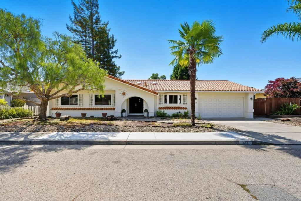 Single level Santa Cruz Gardens home backing to green space with privacy and views. Mediterranean styling with stucco exterior, tile roof, and palm trees out front. Great floor plan with a large living room with vaulted ceilings, arched windows, gas fireplace, and an adjacent dining area. Kitchen features a pantry, gas stove, island, and bay window over the sink. Step outside to a sunny deck overlooking the greenbelt plus a side yard for gardening or play. Extra deep 2 car garage with laundry area and room for storage or workshop. Recent quality updates include new electrical panel, interior paint, new carpets in bedrooms, roof and gutter work, tree maintenance and much more. Sale also includes an additional 2.75-acre parcel (not buildable) that provides extra privacy.