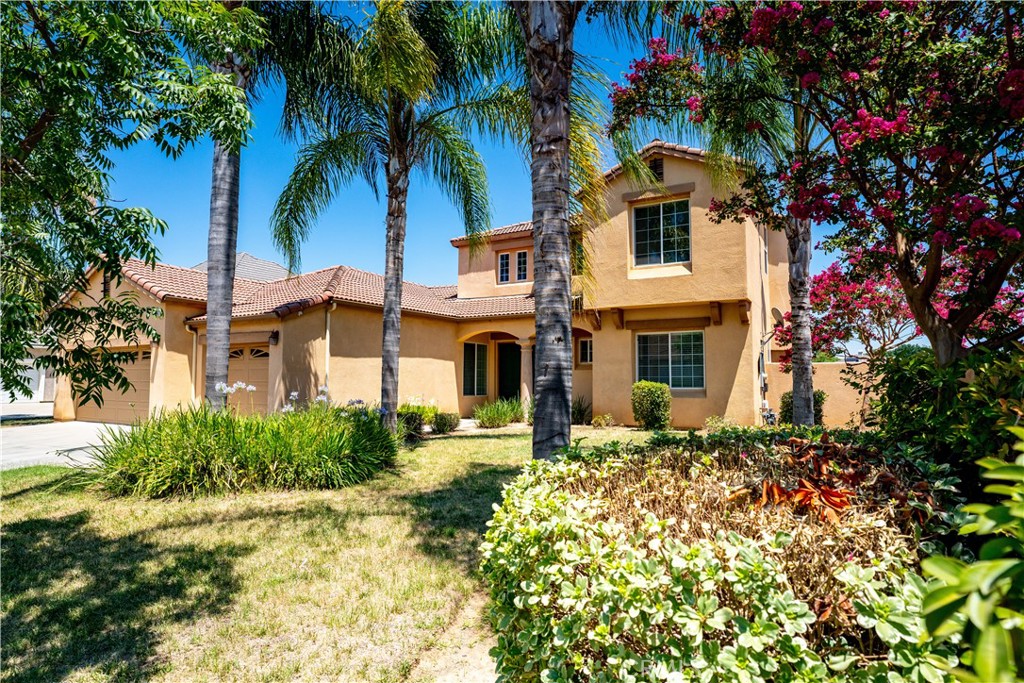 Welcome to 8185 Lakeshore Drive-Where resort living meets every day life! Situated in a desirable golf course community, this 5-bedroom 4-bath home offers the perfect blend of comfort, space and scenic beauty. Enjoy quiet mornings on your back patio with views of the lake, or entertain your guests in your spacious open-concept kitchen and living area. Step inside to find high ceilings and tons of natural light. The layout is ideal for both growing families and those who love to host, with generously sized bedrooms, large living areas, and a private downstairs guest suite. 3-car garage. This active HOA community offers an array of amenities, including: gated entry with security, community pool and spa, basketball courts, lake access for paddleboats, parks and greenbelts throughout the neighborhoods. Lakeshore Drive, love where you live-and live like you're on vacation every day! Schedule your tour today!