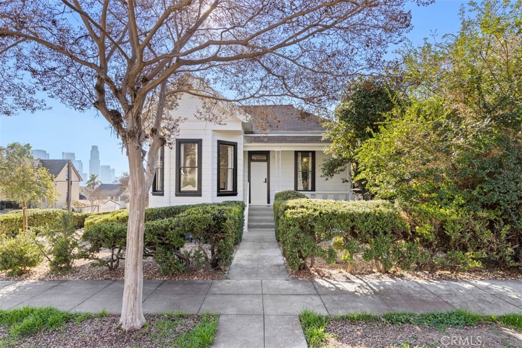 1400 Carroll is an an artfully restored historical triplex in the heart of Echo Park, one of Los Angeles’ most vibrant and sought-after neighborhoods. The property currently offers a return of 5.74%, with the existing A+ tenants paying $7,196, $5,400, and $3,502 in rent. Additionally, the property is being delivered with SHOVEL READY plans for a freestanding 2-bedroom, 2-bathroom ADU and RTI plans for a second 2-bedroom, 2.5-bathroom freestanding ADU. We project over $1 million in added value with the construction of these units.
Located on Douglas Street, widely regarded as one of the most charming streets in the area, this property is just a short distance from Echo Park Lake, the iconic Baxter Street Stairs, and neighborhood favorites like Lowboy, The Echo, and Bar Flores.
Fully remodeled from top to bottom, 1400 Carroll features brand-new systems, high-end custom finishes, and thoughtfully designed interiors, blending modern amenities with timeless character. The unit mix includes two 4-bedroom, 3-bath units and one 2-bedroom, 2-bath unit, all boasting in-unit washer/dryers, landscaped patio areas, and bespoke finishes that make each space truly unique. To sweeten the deal, the triplex comes fully furnished, offering a turnkey opportunity for investors or owner-users.
Buyers who build the ADUs could achieve close to a 7.5% cap rate, ensuring strong returns in one of LA’s hottest markets. From its prime location on a historic street and meticulous renovation to its incredible upside potential, 1400 Carroll St is a rare find in Echo Park. Don’t miss this chance to own an artfully restored gem with modern amenities and exceptional long-term value in one of Los Angeles’ trendiest neighborhoods!