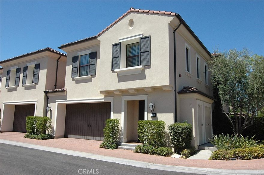 Prime and quiet interior end unit location with w/large park/greenbelt directly behind rear fully functional patio, LARGE BONUS/COMPUTER WORK CENTER, ample parking for guests... Grand entrance to beautiful wood floor greets you to a well designed kitchen w/large sit-up center island with convenient sink, ungraded stylish cabinets, granite, abundance of storage, KitchenAid stainless appliances, five burner cooktop w/backsplash, crown molding, recessed lighting, built-in media center, high baseboards, nice size primary suit w/luxurious bath w/separate glass enclosed shower, deep oval soaking tub, dual vanities, large walk-in closet, spacious secondary bedrooms, w/dual vanities, independent interior laundry w/sink, storage cabinet,  REFRIGERATOR/WASHER/DRYER, well organized two car direct access garage w/epoxy floor, plentiful horizontal/vertical cabinetry..close to superb association amenities, schools, world class shopping, Irvine/Tustin MarketPlace, Spectrum, short distance to John Wayne Airport