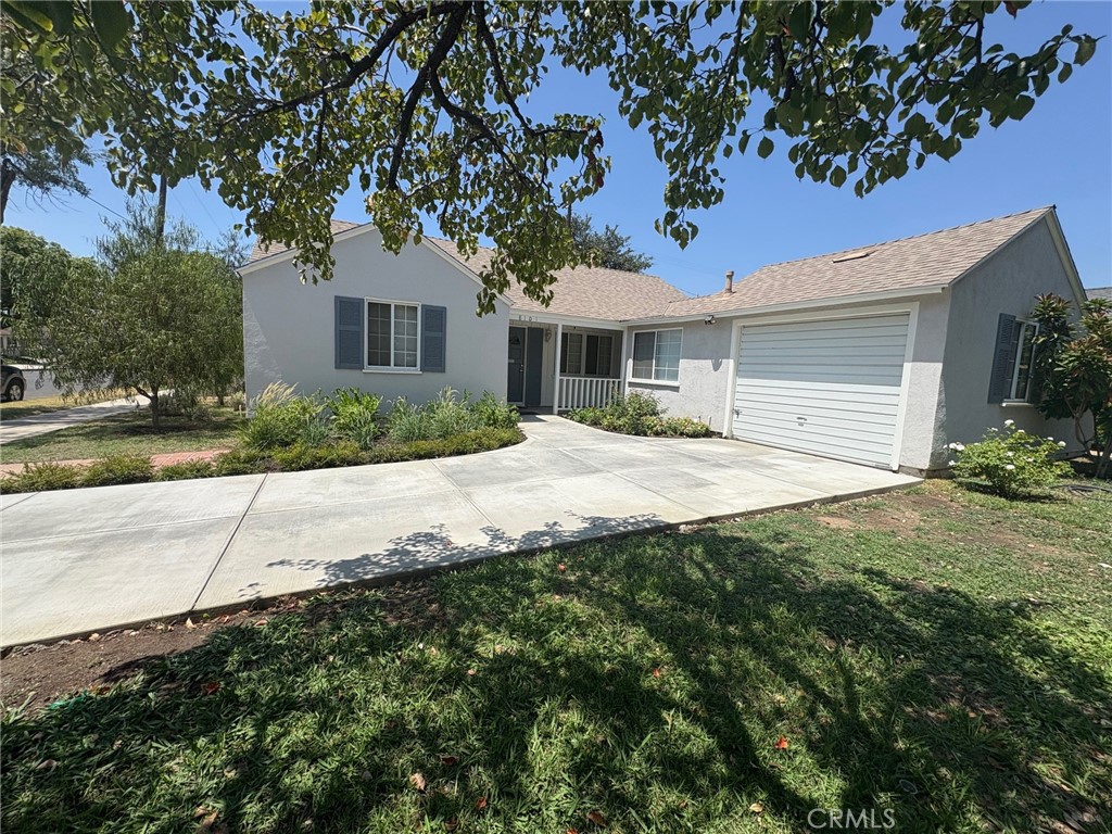 Welcome to this adorable home in Northridge. Of the many upgrades in this home there is a brand new kitchen complete with custom cabinets, soft close drawers, porcelain counter tops, coffee station, pantry, breakfast area. New lighting, new door and new window in kitchen. LVP floors in the kitchen, living room and family room. Laminate floors throughout the rest of the home. 3 bedrooms with large closets, guest closet, 2 large linen closets. Brand new driveway. Washer/dryer and refrigerator are included. The private back yard has a stone patio, grass area and orange tree.