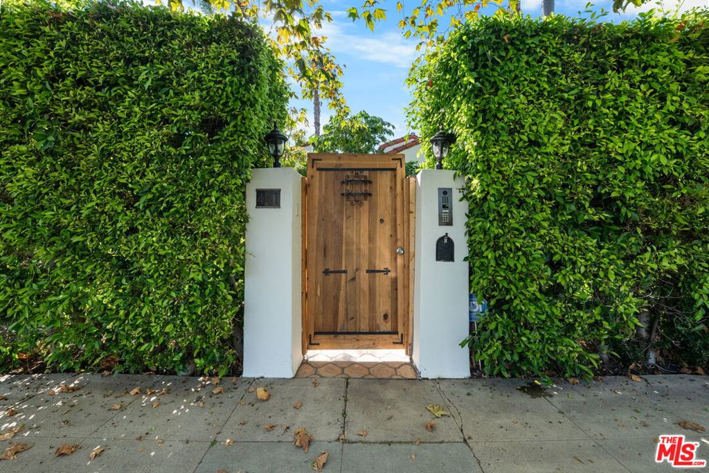 Tucked away on a quiet street in one of LA's most desirable neighborhoods, this beautifully updated 3-bedroom, 3-bathroom Spanish-style home blends timeless character with modern comfort. Light-filled and airy throughout, the home features brand-new windows, updated bathrooms, and a whole-house reverse osmosis water filtration system.The inviting floor plan includes a cozy breakfast nook, an elegant formal dining room, and a spacious living room perfect for relaxing or entertaining. The renovated primary suite offers a spa-inspired en suite bathroom with a luxurious shower and a large walk-in closet. Step outside to enjoy a beautifully landscaped backyard, a detached converted garage with bathroom perfect for guests, additional living space, or work, and a private rooftop sun deck. A property that is both ideal for outdoor entertaining or quiet retreat. Centrally located and just minutes from some of LA's best shopping, dining, and entertainment, this home is the perfect blend of privacy, style, and convenience.