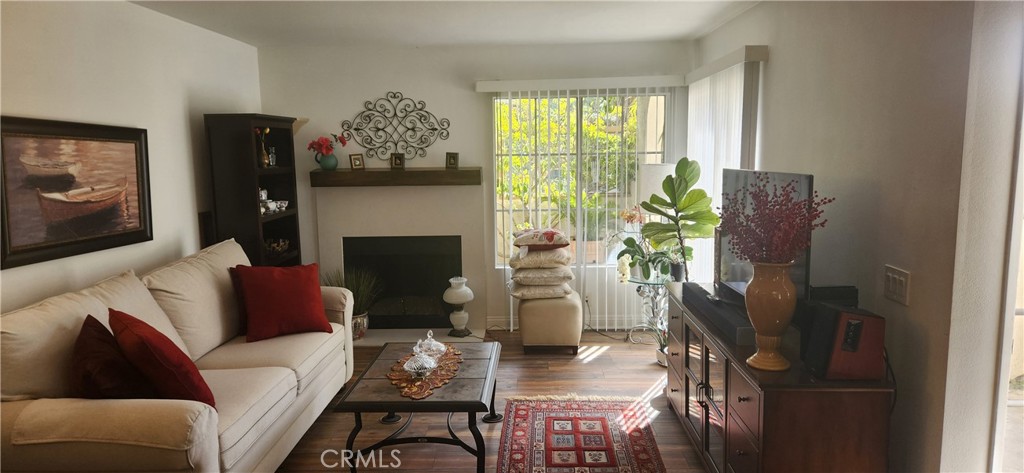 This immaculately renovated corner lower unit with no steps inside condo is furnished with clean and nice furnitures. As furnished, it comes with all plates, glasses, pots/pans, and all the utensils. It also includes all the kitchen appliances, a king size bed with all the bedding, fully sanitary fixtures stocked bathrooms, fully furnished living room including the T.V. , and a fireplace to extend your feet by to warm yourselves up. This is a remodeled pride of ownership, top drawer condition with two bedrooms, two fully remodeled full baths and easy ground level entry with indoor washer/dryer. Inside you will enjoy the openness, brigh, and airy living room and a large kitchen with newer custom 'soft close' cabinets that include pull-outs and lazy-susans with expanded counter space and added FULL PANTRY. The master bedroom has double door entry, large walk-in closet and spa like remodeled master bathroom with oversized custom tile walk-in shower and a wall of custom cabinets for even more storage. Second bedroom has slider to the patio and a walk-in closet as well and has easy access to second fully remodeled bathroom. This corner unit with a large private wrap-around patio and views of trees and a greenbelt offers warm and outdoorsy feel to this lovely floor plan that has two storages areas as well as a cuzzy entertainment area. Community pool and spa is within a few steps, green belts, walking trails, close by markets, restaurants, entertainments, and easy access to 73 toll road and I-5 freeway are some of the other features of this beautiful and well kept community.