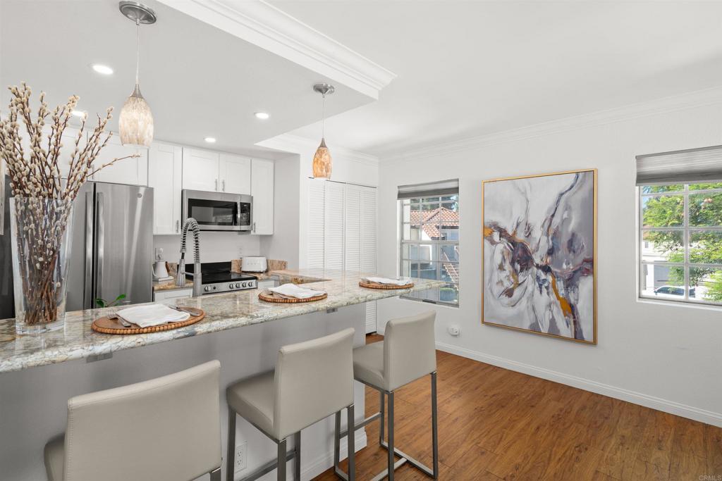 LOVELY TURN KEY CHARMING STUDIO FEATURING MODERN WHITE CABINETS, STAINLESS STEEL APPLIANCES, GRANITE COUNTERTOPS, NEW A.C. UNIT, W&D, WATER HEATER & APPLIANCES WERE INSTALLED IN 2021. CONVENIENT IN-UNIT LAUNDRY CLOSET, MURPHY BED THAT MAXIMISES LIVING SPACE! IMPECCABLE WOOD LAMINATE FLOORS. BATH WITH CUSTOM CABINET & GRANITE COUNTERTOPS. ENJOY A CUP OF COFFEE ON THE PRIVATE BALCONY SURROUNDED BY BEAUTIFUL TREES! ONE CAR GARAGE/DETACHED. IDEAL FOR INVESTORS OR FIRST TIME BUYER WITH EXCELLENT POTENTIAL FOR HIGH RENTAL INCOME. PRIME LOCATION. NEAR A BEAUTIFUL LAKE WITH FISHING, PADDLE BOAT, BBQ, VOLLEYBALL AT THE SANDY BEACH, TENNIS COURTS. CLUBHOUSE PERFECT FOR HOSTING A SPECIAL EVENT. IN ADDITION JUST MINUTES FROM AWARD-WINNING SCHOOLS, TRADER JOE'S, SHOPS, RESTAURANTS AND FREEWAY. NO MELLO-ROOS! THIS RARE FIND COMBINES AFFORDABILITY, CONVENIENCE AND THE JOY OF LAKE LIVING! IT WON'T LAST!