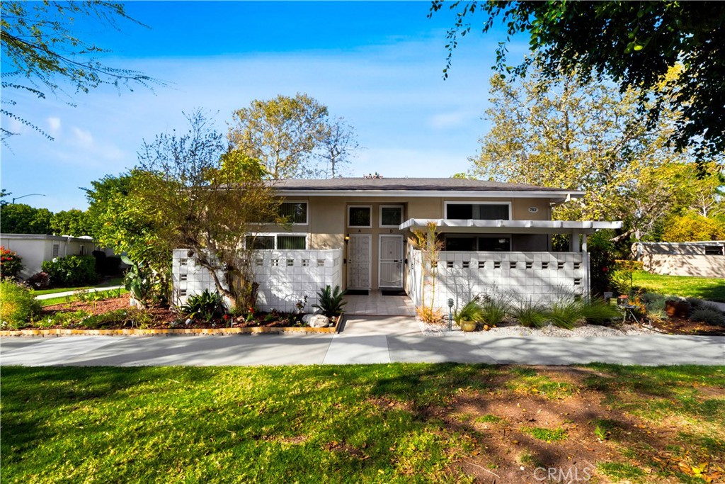 Welcome to this beautifully remodeled, easily accessible end-unit Seville model townhouse-style co-op, located in a gated 55+ resort-style active living community. This charming home feels like a single-family residence, with no one above or below, and is priced furnished (think AirBNB with disheslinens, etc) or can be sold unfurnished. The home features smooth vaulted ceilings and abundant natural light from newer dual-pane windows. Downstairs, elegant wood-look flooring enhances the bright, open layout. The open and remodeled kitchen offers custom cabinetry, a built-in china cabinet, recessed lighting, tile flooring, granite countertops, and a dual-sink with a view. The spacious kitchen is equipped with a glass-top range, microwave, dishwasher, and two refrigerators. A large sliding glass door opens to a private patio surrounded by lush greenspaces, perfect for relaxing with pets. The garden includes a lemon tree, pomegranate, dragon fruit, and colorful flowers. The home has a main-level primary suite, upstairs second suite/loft bedroom, and a large attic with pull-down ladder for storage. Three new (2022) energy-efficient mini-splits provide year-round comfort. Conveniently located with abundant parking right in front (no steps) and a carport (spot #1) with extra storage. As a co-op, the HOA maintains many of the interior elements. Close to shopping, dining, Clubhouse #1, and the community library. Laguna Woods Village boasts unparalleled amenities, including five heated swimming pools, four hot tubs, seven clubhouses, and a 27-hole championship golf course with a clubhouse, restaurant, and bar. Additional features include a 9-hole par-3 executive course, driving range, EV charging stations, 24-hour security, three fitness centers, and an equestrian center. The community also offers woodshops, art studios (for pottery, glass, lapidary, jewelry, and painting), a performing arts center, RV storage, lawn bowling, a dog park, computer support, paddle tennis, pickleball, and garden centers. Beyond these amenities, the Village is home to over 250 clubs and organizations with activities such as yoga, hiking, dancing, photography, and wine appreciation. A free bus service within the Village and to nearby shopping and medical centers ensures unmatched convenience. Located just minutes from Laguna Beach, the ocean, and major freeways (5, 73 and 405), this property is truly one of Orange County’s hidden gems. Water, trash, and basic cable are included in the HOA.