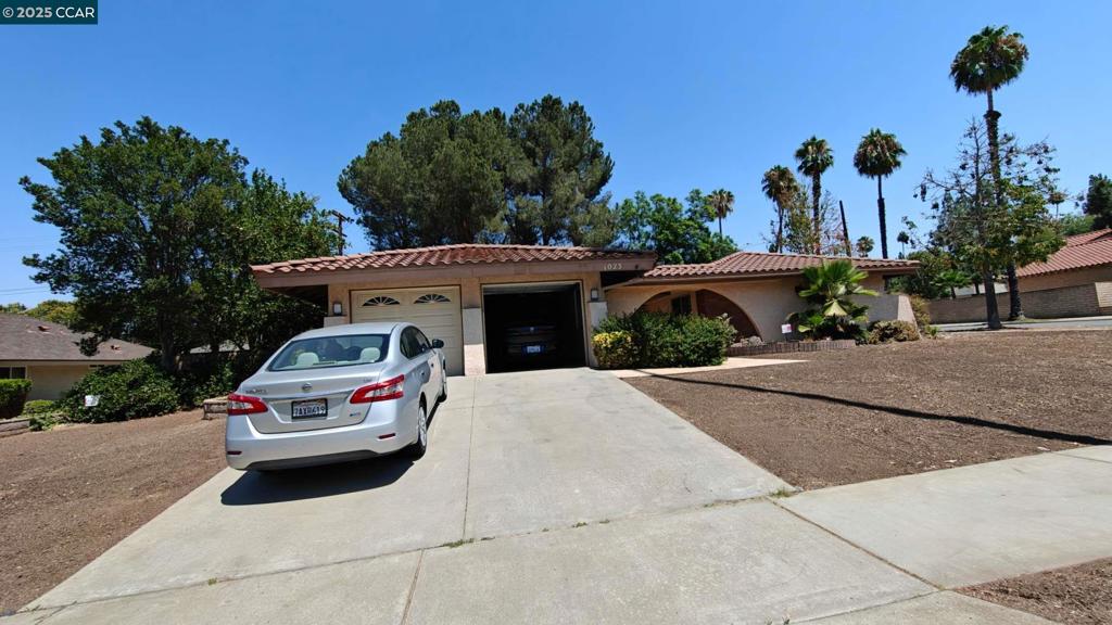 Welcome to your new sanctuary! This 4 bedroooms, 2 bath Spanish revival style inspired home offers a bright and airy open floor plan perfect for gatherings. This home features newly renovated floors in addition to a new stove top, new range, new dish wash, new microwave, new modern celling fans, and new painting. There are two garage door and plenty of driveway access. The kitchen presents a fabulous granite countertop with lots of kitchen storage. Enjoy calm mornings in the spaciuos living room with natural sunlight sponsored by the slinding glass door leading into side yard. The backyard features a lovely quaint pool. great place to cool off and ideal for the hot days. Conveniently located near several parks, UC riverside and Canyon Crest town.