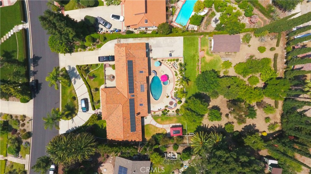 Welcome to this gorgeous San Antonio Heights single-story pool home. The property is a meticulously updated design that enhances both aesthetics and functionality. Upon entering the wide doors, the formal entry, foyer, and formal living room, with open-beam ceilings, wide hallways, and custom lighting, the attention to detail is immediately evident, creating a spacious and inviting layout. The living spaces feature finished Spanish plaster walls complemented with marble floors and wide baseboards, providing a sleek and modern touch and quality. An ample family room, dining area, and remodeled kitchen all offer a view of the beautiful pool and backyard, complete with multiple fruit trees. A glass door system opens up the wall for a seamless connection between the interior and outdoor living areas. Step outside to the lush landscaped grounds, where a remodeled pool, spa and Jacksy await. Complemented by the serene backdrop, the pool area is a private oasis perfect for relaxation and recreation. Entertain friends and family on the spacious patio or unwind in the tranquility of your outdoor paradise. Bathrooms have been remodeled, featuring walk-in showers with custom glass doors and elegant cabinets. The bedrooms feature ceiling fans, with the primary room boasting a sliding glass door that provides access to the pool and offers a tranquil view, making it a must-see.
Don't miss the opportunity to own a home in one of Upland's most coveted communities—schedule your private tour today!
