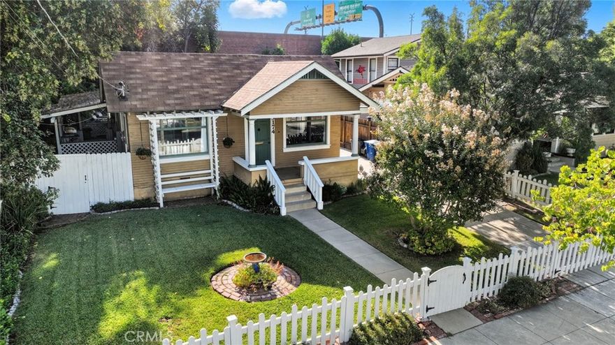 This single-story Craftsman Bungalow features 2 bedrooms, 1 bath, and a detached garage. It is located in the HERITAGE SQUARE HISTORIC DISTRICT and is being sold in as-is condition.



Historical details indicate that the historic name is the "James O. and Maud McCall House," which was built by J.T. Nicholson. This simple one-story Craftsman residence includes Colonial Revival details. Craftsman features include a cross-gabled roof with slightly extended eaves and exposed rafter tails. The partial-width porch has a closed brick masonry railing. A trellised porte cochere extends to one side of the structure. A band of vertically placed window panes forms a header across the large rectangular front windows. The Colonial Revival influence is displayed in the classical columns supporting the front porch. The exterior is covered with clapboard siding, and a picket fence encloses the property.



Inside, the living room features wood flooring and traditional 1920s built-in shelving, cabinetry, windows, and moldings. The restored kitchen and bathroom maintain the original vintage feel, featuring vibrant tile, cabinetry, and shelving —a style that continues into the hallway, linen storage, and bedrooms.



Outdoors, step through the kitchen door, down the covered patio, into your private backyard oasis. Follow the pavers to a charming hammock hut, your perfect spot for an afternoon nap. A separate concrete slab area offers a clean, stable space to relax under the shade and fresh scent of the tangerine fruit tree.



The location is within walking distance of downtown Riverside, offering a variety of entertainment, retail, parks, museums, public transportation, freeway access and more.