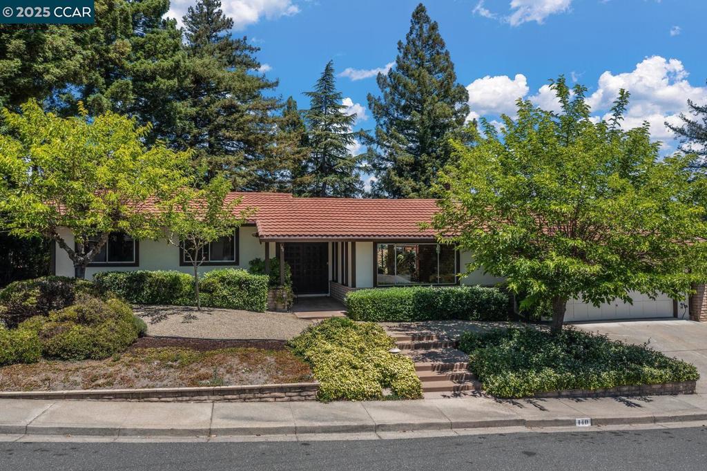 New Listing! First time on the market...ever! Custom designed with a unique elegance and charm facing a spectacular view of the Moraga Valley including the St. Mary's College Steeple. Recently updated with Engineered wood flooring throughout the entertaining area. The residence features a spacious family room with a formal dining area adjacent to the sun filled kitchen with the fabulous views and features a casual dining area. There are sliding doors throughout leading to an expansive brick patio area. The lawn was gone long ago but could be replaced. The back yard and front yard feature mature vegetation. The large living room has a beautiful adobe fireplace and period glass windows that glow with the sunset. The bedroom wing has all four bedrooms at the same wing of the house. The primary suite opens to a large covered deck to enjoy the towering Redwoods and lovely views. Warfield is a cul-de-sac bordering open space very quiet and peaceful Just a minute from Los Perales Elementary school. Open Saturday and Sunday 1-4. Views: Ridge