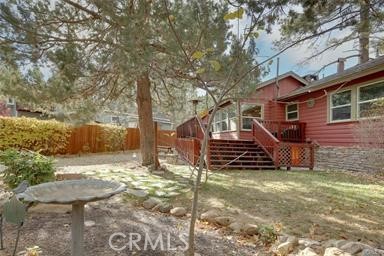 This house is located near the big bear lake with beautiful partial lake view, pleasant breezes of fresh air courtesy of mother nature. Serena, tranquil, ,safe and beautiful neighborhood, Especially conducive for indulging in peace and quietness. If you are looking for a tranquil mountain escape located just steps from Big Bear Lake, you've come to the right place! Serenity's Whisper is a vintage cabin with a modern touch! Recharge in the fresh mountain air while lounging on the spacious deck, or cozy up by the fireplace with the family! Vintage red cabin in the mountains with a modern touch! Gorgeous outdoor areas to relax, and ample indoor living spaces to enjoy! Two bedrooms, one bath. Dedicated workspace and new modern kitchen stocked with all cooking necessities!