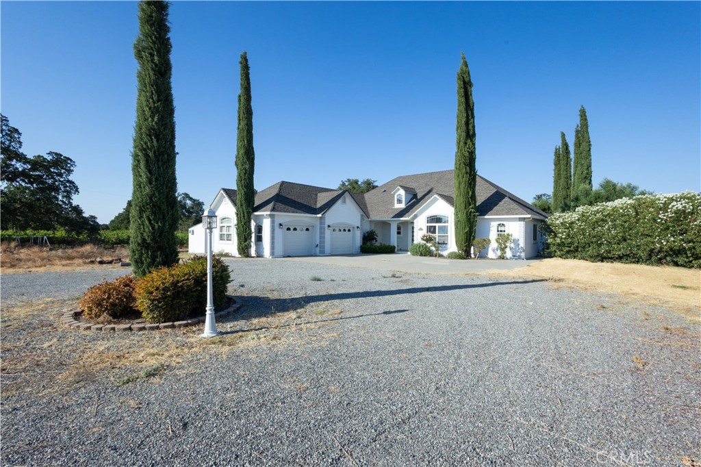 YOUR DREAM ESTATE AWAITS! This one checks all the boxes. Enter via tree and pasture lined streets to the quiet sophistication of Wells Fargo estates. This twenty acre parcel boasts a shared pond, a private vineyard, an outdoor oasis and the perfectly updated residence. Enjoy your very own vintage wines (aging peacefully in your temperature controlled wine cellar) while playing bocce ball or horseshoes, or just relax next to the crystal blue pool or outdoor barbeque. Inside you will find a tastefully updated home with marble floors throughout, vaulted ceilings, and owned solar! The master suite includes two walk in closets and a freshly remodeled dream shower. The additional two bedrooms share a jack and jill bath, with an additional half bath for guests. So much room to store your toys or tractor in the extra large garage. Bring your horses, goats, llamas, you name it. Located close to 99 for a quick Chico commute. This one won't last long!