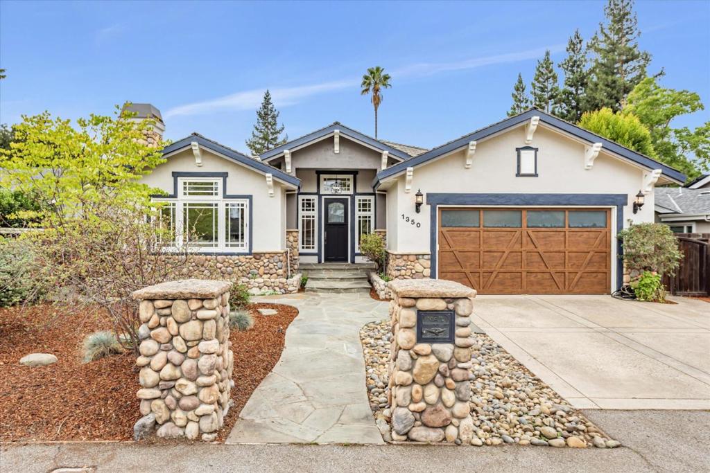 Captivating blend of elegance and warmth in prestigious South Los Altos community. Meticulously designed residence, complete with a dedicated office, offers a seamless fusion of sophistication and comfort. Step into a sunlit foyer with leaded glass details leading to a spacious living area, marble fireplace and high beamed ceilings. The home flows effortlessly with engineered european oak flooring throughout, enhancing the elegant ambiance. A geometric dining room, featuring a coffered ceiling with accent lighting, provides a memorable setting for both intimate gatherings and formal dinners.Gourmet kit. equipped with premium appliances, large island, built-in storage, and a scenic view over the lush backyard. Opens to family room with a soaring beamed ceiling and wall-to-wall bookcase, perfect space for relaxed family living or entertaining. Professional-grade home office is a dream workspace, ample storage and space for meetings. Each bathroom is a spa-like retreat, with Jacuzzi tubs, while the primary suite features a private patio and a luxurious ambiance for ultimate relaxation. An enchanting arbor invites al fresco dining and tranquil mornings in this expansive yard. Includes EV station in the two-car garage, top-rated schools, and a welcoming neighborhood atmosphere.