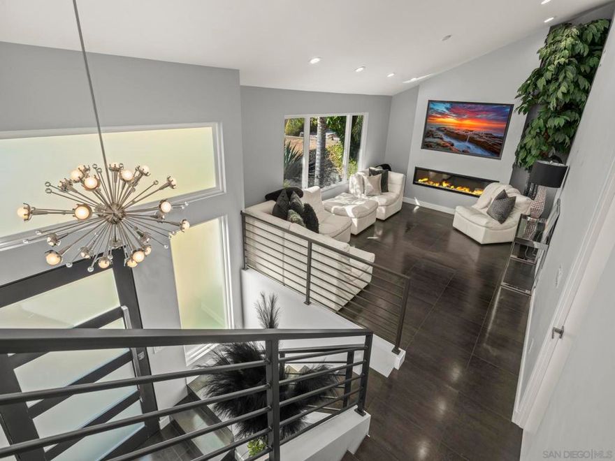 This property is being offered in a value range of $1,280,000-$1,339,000. Tucked into the serene rolling hills of Western Poway, this residence delivers an exceptional escape from the rush of city living. Set within a coveted enclave of classic mid-century homes, it pairs clean, modern lines with a warm, inspiring ambiance. The interior has been thoughtfully reimagined with high-end upgrades throughout, creating a true contemporary showcase. The expansive lot offers a pristine blank canvas, poised for the outdoor retreat of your dreams. Located on one of Western Poway’s most charming storybook cul-de-sacs, this home blends peaceful neighborhood living with exceptional practicality. The conveniences of Poway and its top-tier school district are just minutes away, and the highly desirable western position places you within easy reach of the I-15 and the broader San Diego region.  Beyond its serene setting in the rolling hills, this home delivers the rare comfort of knowing so many details have already been thoughtfully reimagined. Between 2019 and 2020, the property underwent an extensive transformation—modernizing the essentials while elevating the overall design. Step inside to find sleek tile flooring throughout, vaulted ceilings in the split level loft living room, and an open, airy kitchen expanded with a custom long-span steel beam. New Milgard Tuscany windows and sliders flood the home with light, complemented by a striking custom pivot entry door that instantly sets the tone. The kitchen features granite counters, stainless appliances, upgraded 3/4" gas service to the range, and direct access to the outdoors through the oversized slider. Every bathroom has been fully remodeled with granite counters, custom cabinetry, and designer tilework—plus a new tub in the upstairs bath. The entire home was re-insulated and finished with 5/8" drywall for improved quiet and energy efficiency, paired with new central heat and AC, a 50-gallon water heater, upgraded electrical, and a refreshed roof for peace of mind. A standout bonus is the garage conversion, now a stylish bonus suite with its own full bath and mini-split system—perfect as a guest hideaway, home office, or studio. Even the remaining garage space benefited from the renovation, gaining new tile flooring and an electrical sub-panel. Here the home is perfectly ready to come in and live a beautiful life. What remains is the fun part: shaping the generous lot into the outdoor retreat you’ve always imagined.